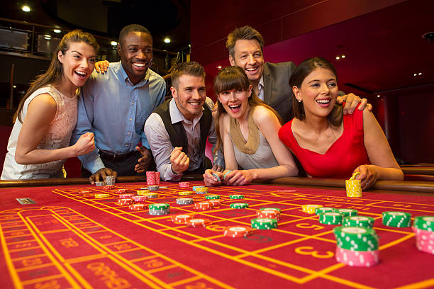 Live dealer hosting a roulette table with player interaction